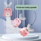 rafika prezentująca test upadku różowej szczoteczki sonicznej. Wizualizacja solidnej konstrukcji z napisem "Przetrwa każdy upadek", potwierdzająca wytrzymałość produktu przy użytkowaniu przez dzieci